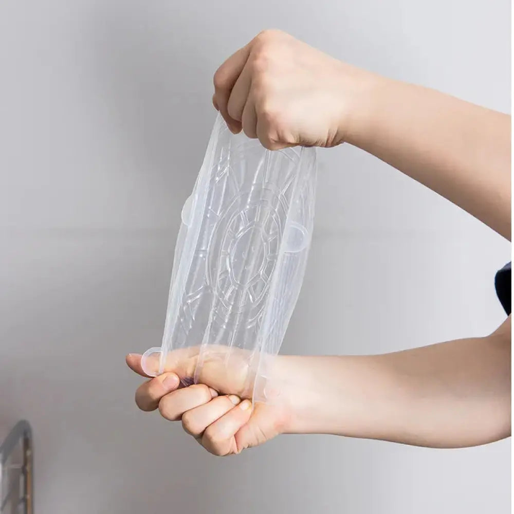 Transparent plastic shower curtain with embossed circular pattern and reinforced grommets for bathroom use