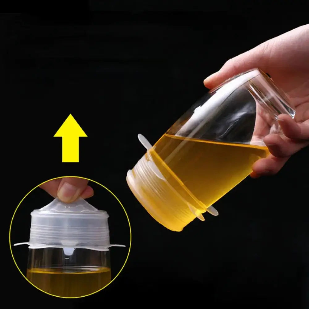 Clear glass jar with white plastic lid and silicone seal filled with golden honey in 6-pack reusable silicone stretch lids