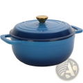 6qt blue enameled cast iron dutch oven with gold knob and two side handles shown with silicone gloves