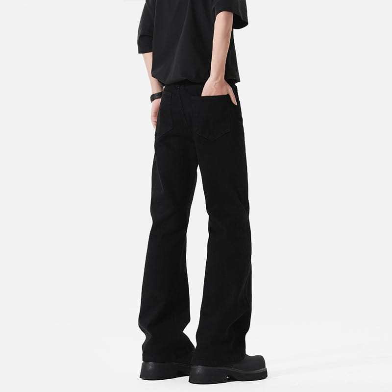 modern black straight leg bootcut denim jeans featuring black wide-leg trousers made of smooth matte-finish fabric with clean stitching and classic front pockets