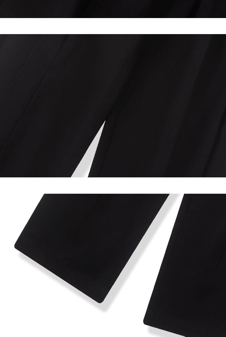 Pantalones de vestir anchos plisados color gris oscuro para hombre con un acabado mate suave y dobladillos limpios de corte recto