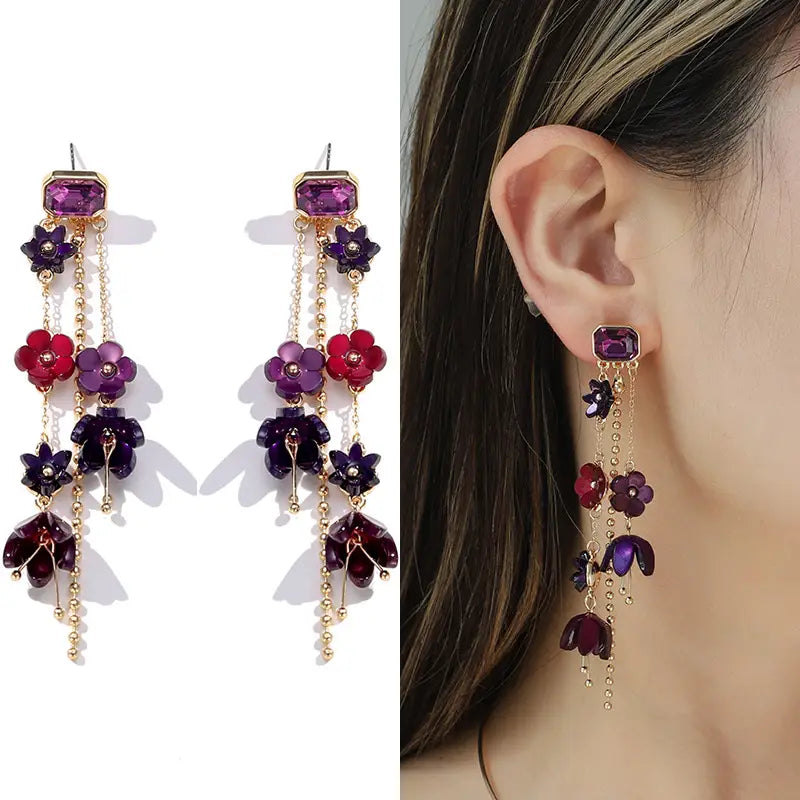 purple and red floral cascade earrings with gold-toned metal accents complementing a gold layered choker with red and purple acrylic flowers