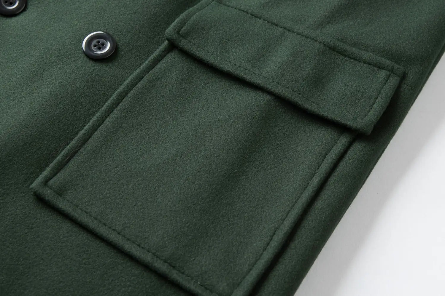 Men double breasted wool overcoat mid length coat in dark green wool featuring flap pockets and black buttons.