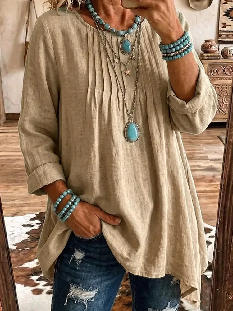 Tunique en lin beige avec manches retroussées et ourlet asymétrique ample conçu comme un haut ample décontracté à manches longues