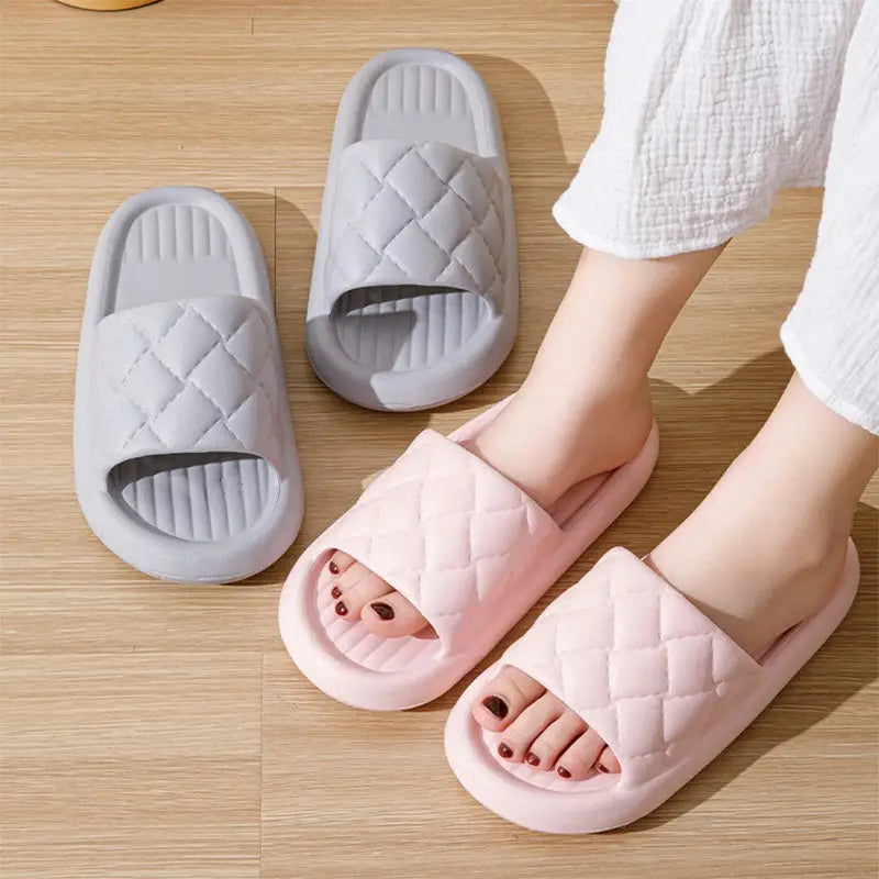 pink and gray quilted slide sandals with a soft cushioned sole designed as non slip lightweight home footwear