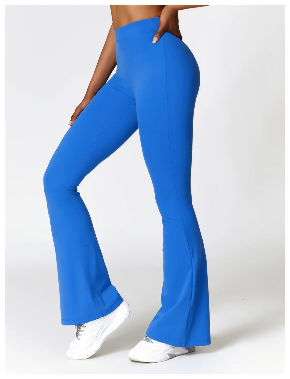 Bright blue high waist flared yoga pants made from flexible material suitable for activewear.