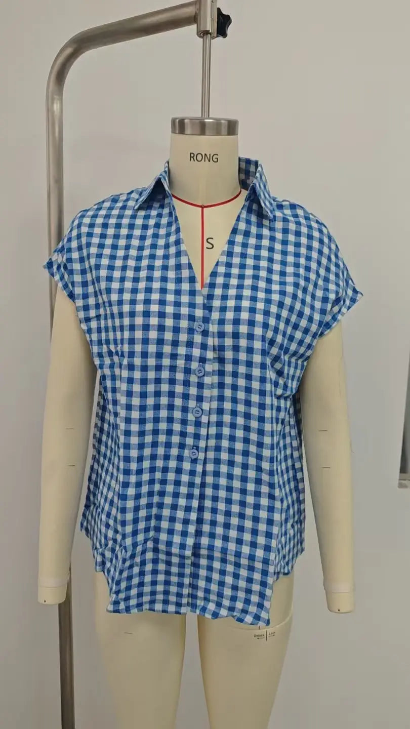 Blue and white gingham short-sleeved button-up blouse with front knot displayed on a mannequin