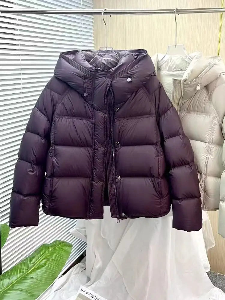 dark purple quilted down puffer jacket with a hood and front zipper designed as a loose hooded winter coat.