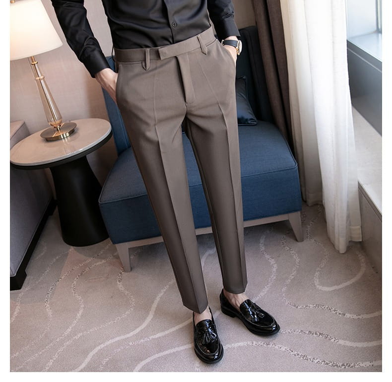 Men’s slim fit British style khaki tailored straight leg trousers with a sleek modern cut and subtle pleats.