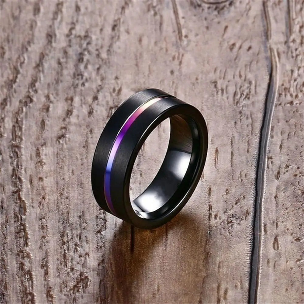 Black tungsten wedding band featuring a vibrant purple and blue gemstone inlay stripe.