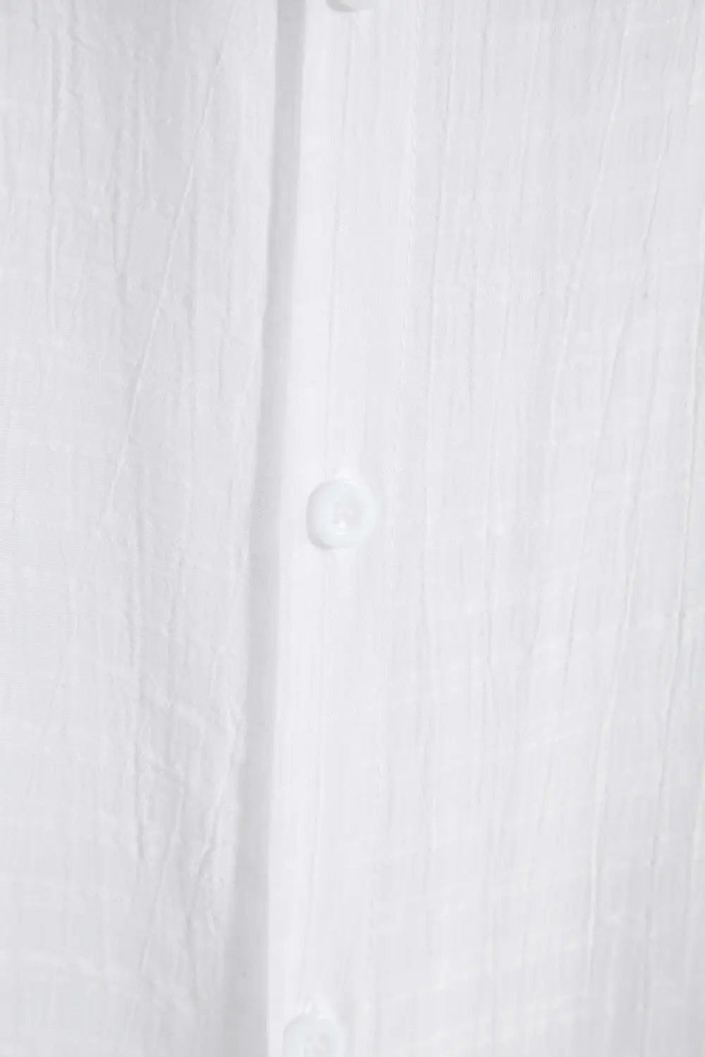 Men’s minimalist textured short sleeve grid shirt in white linen with subtle vertical texture and matching buttons.