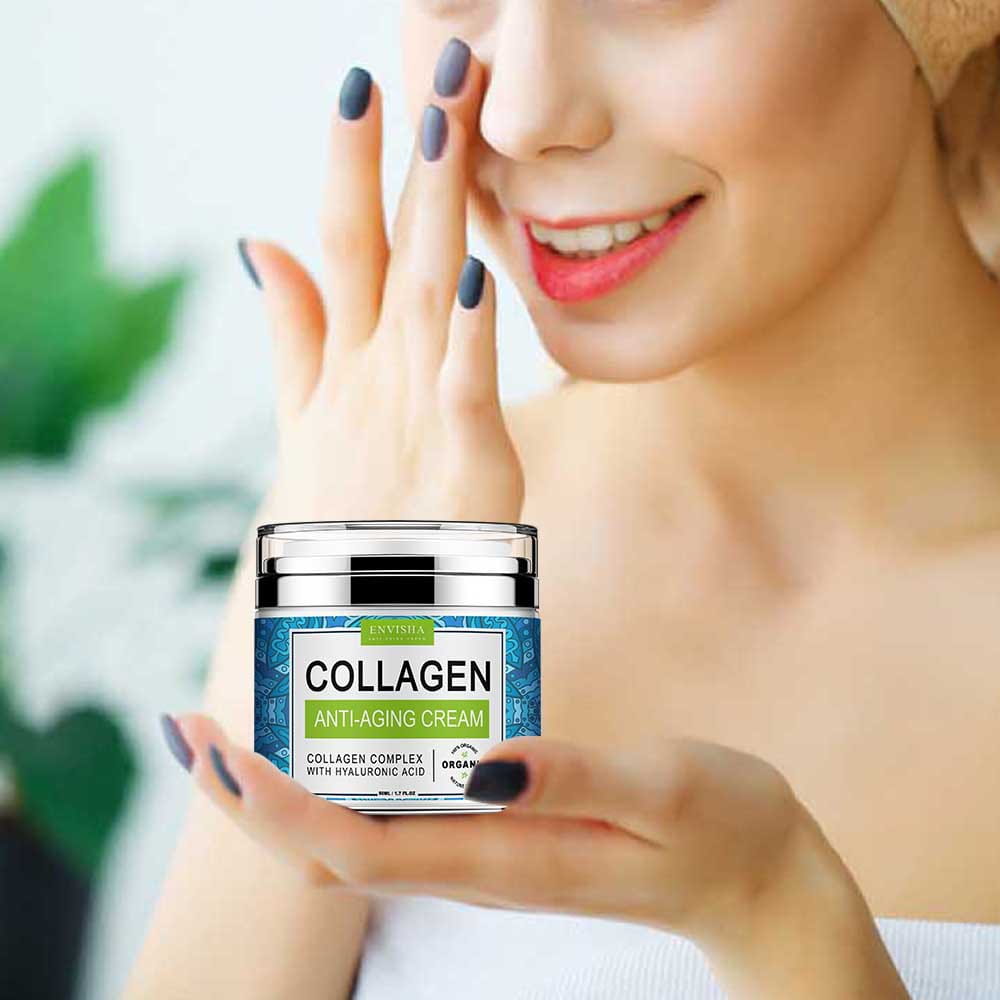 A sleek silver-lidded jar of envisia retinol collagen anti-aging cream with vitamin E features a blue patterned label and green accents.