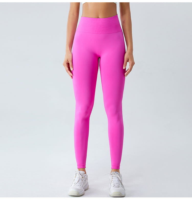 leuchtend pinke Sculptfit High-Waist-Leggings aus dehnbarem, körperbetontem Nylonstoff.
