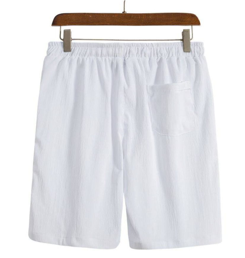Short de plage en coton lin pour hommes blanc, doté d’une ceinture élastique et d’une poche latérale unique