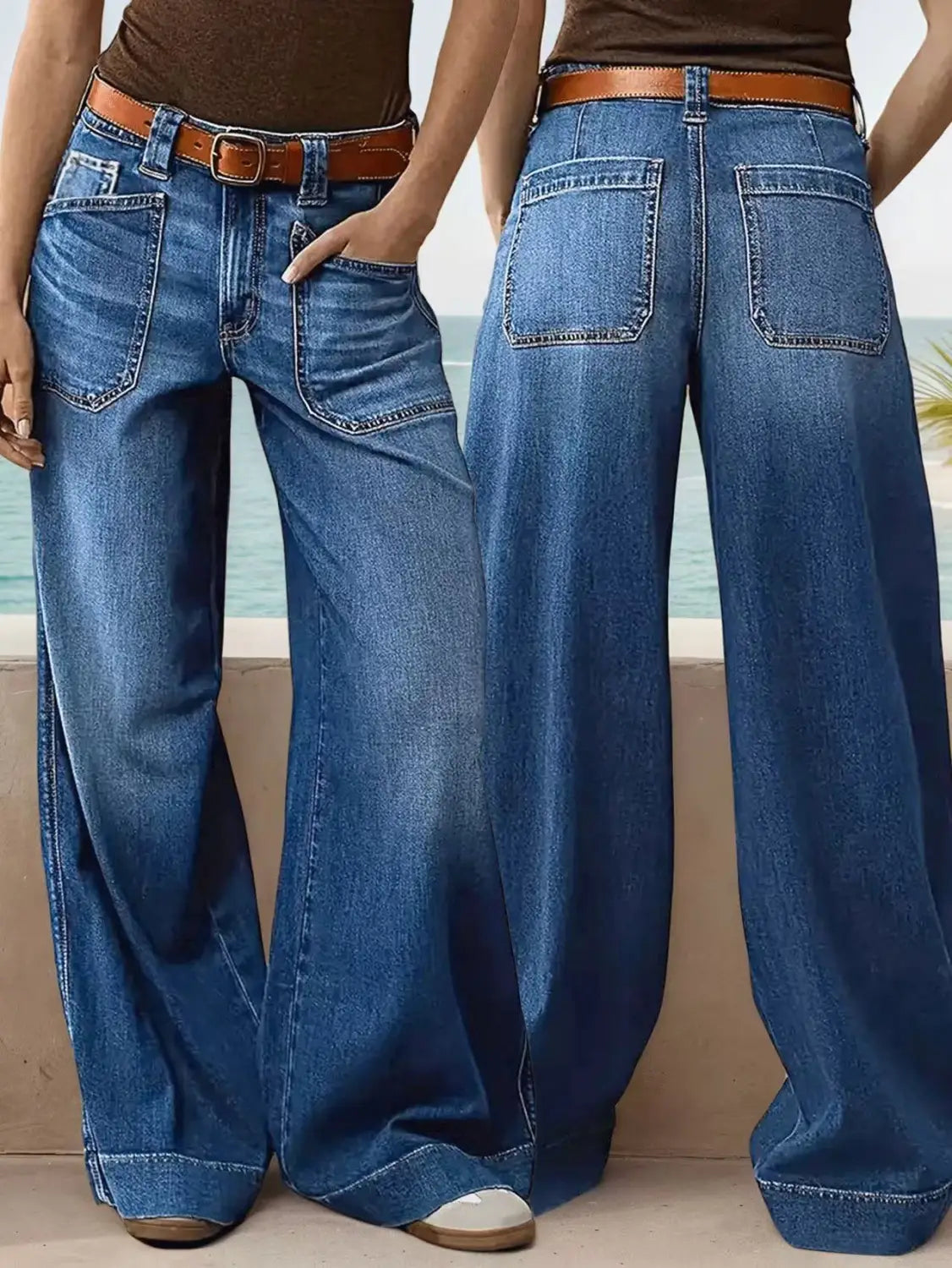 wide leg denim pants in blue with a brown leather belt showcasing a wide leg fit and classic denim material