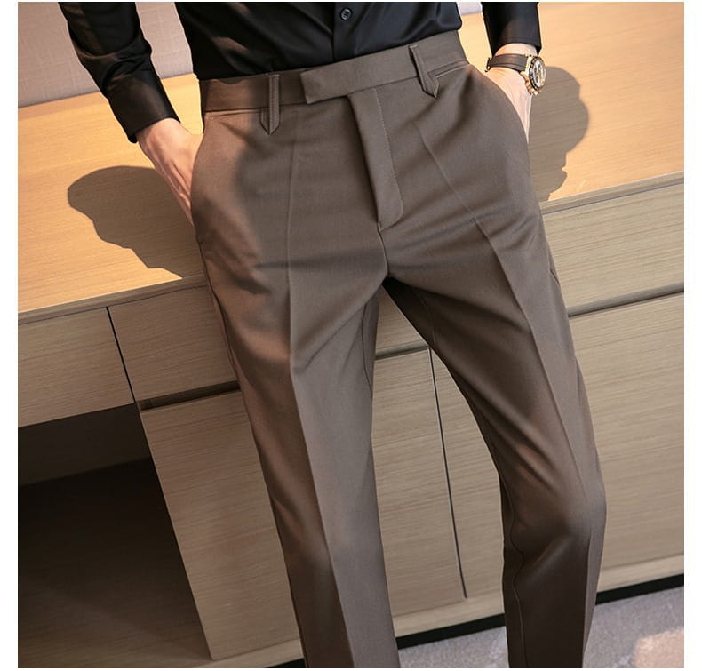 Men’s slim fit British style tailored straight leg trousers in charcoal gray with a sleek modern cut and subtle pleats.