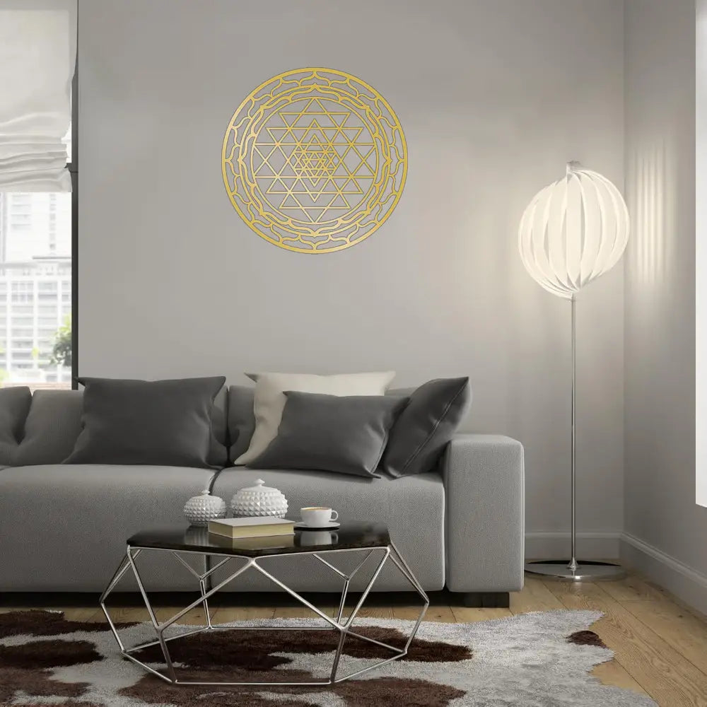 Gold geometric metal wall art featuring intricate triangular and circular patterns in Sri Yantra sacred geometry design.