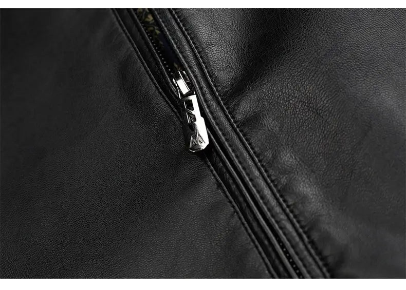 Black leather zipper pull with a silver metallic finish and angular geometric design on a men’s sheepskin leather jacket with thin fleece lining.