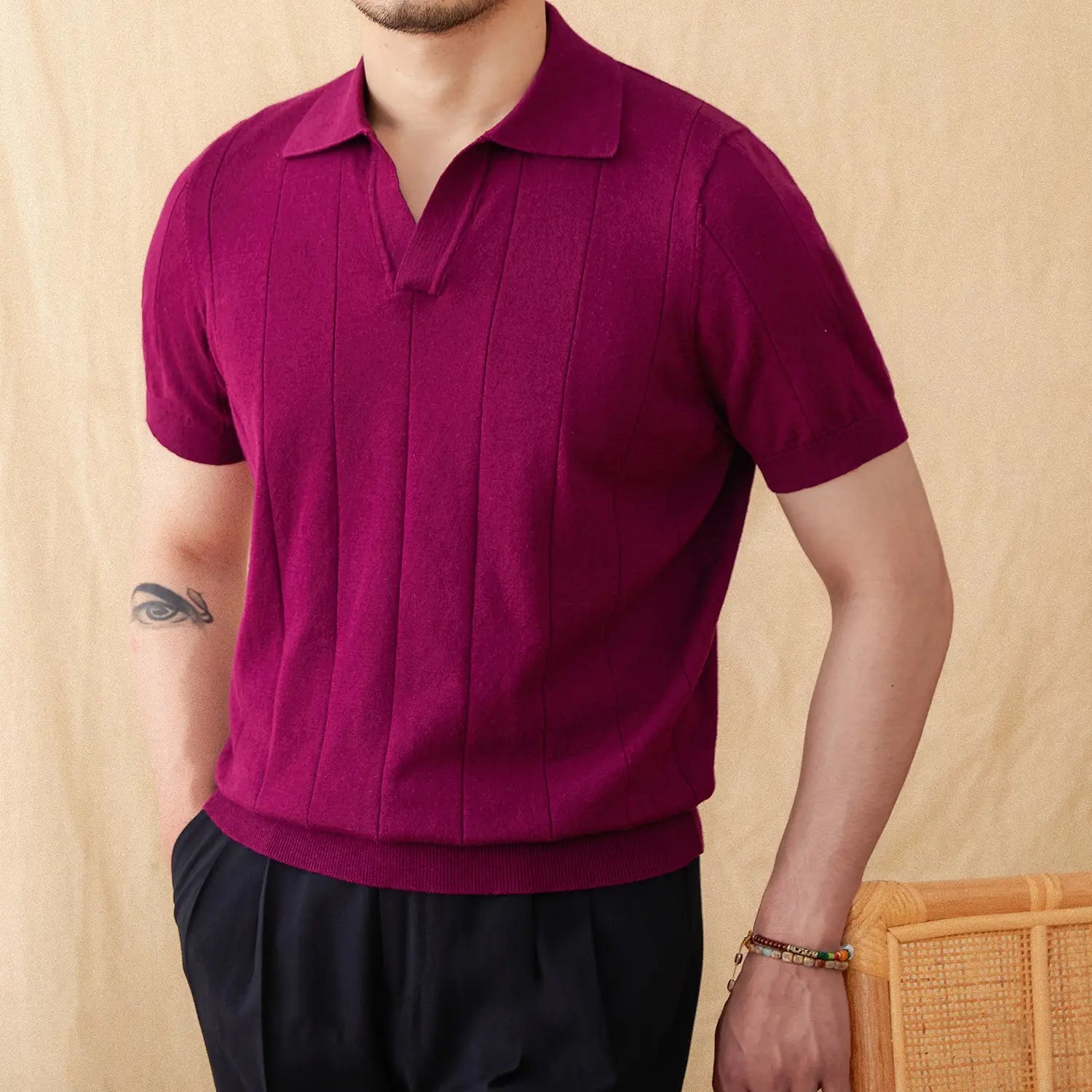 Men knit stripe polo shirt in rich magenta featuring short sleeves, vertical ribbed knit detailing, and a classic collar.