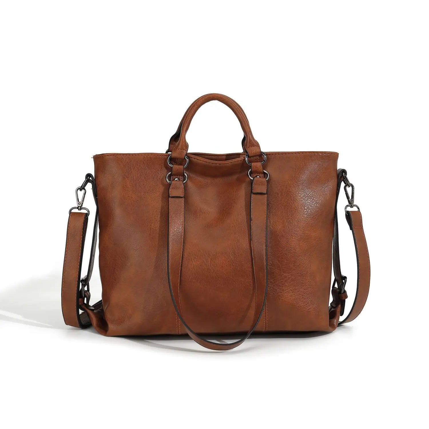 Brown leather tote bag with large capacity, top handles, and detachable shoulder strap for versatile carrying options.