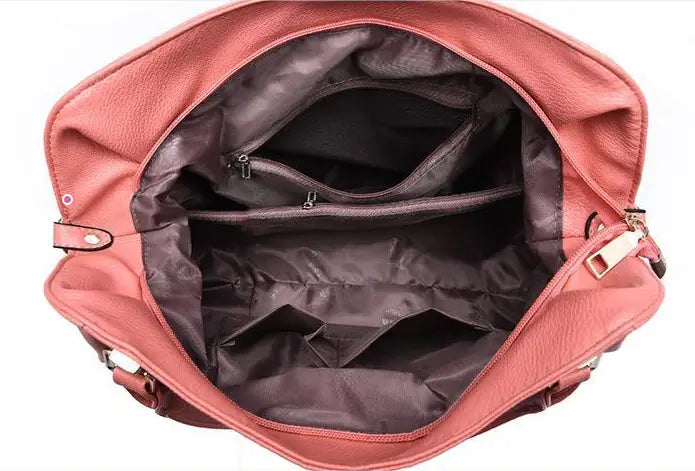 A pink leather women totes bag with a high capacity featuring a dark brown interior and multiple zippered compartments.