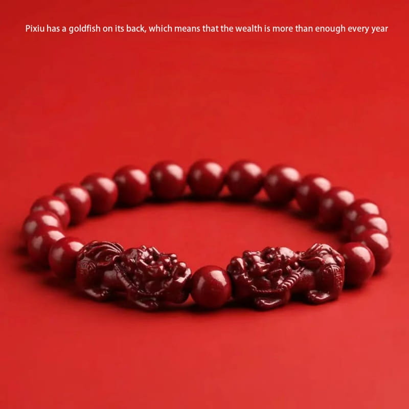 Hand carved purple gold cinnabar double pixiu bracelet featuring a red carved lion charm with glossy beads and intricate detailing.