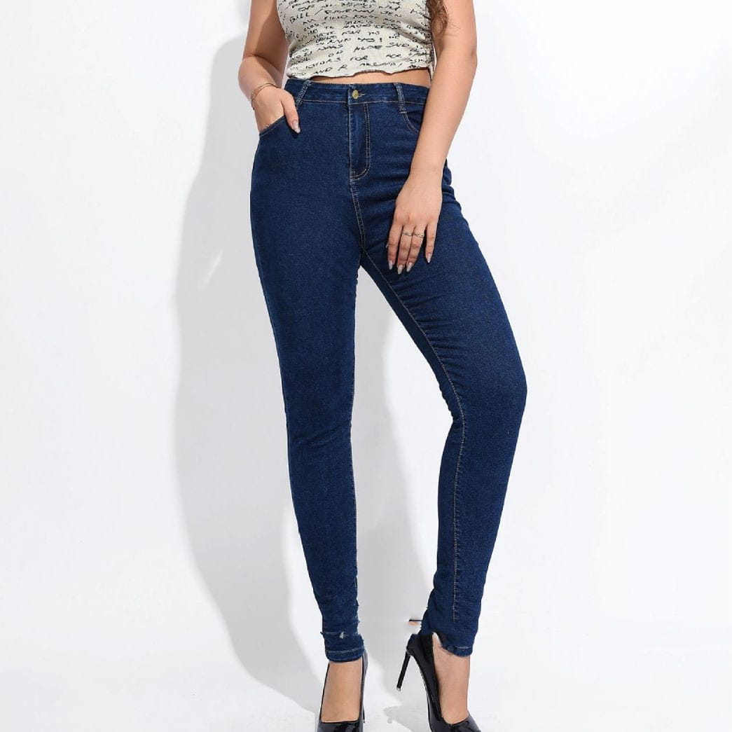 Dark blue high waist stretch skinny jeans with classic denim texture and subtle fading at the knees.