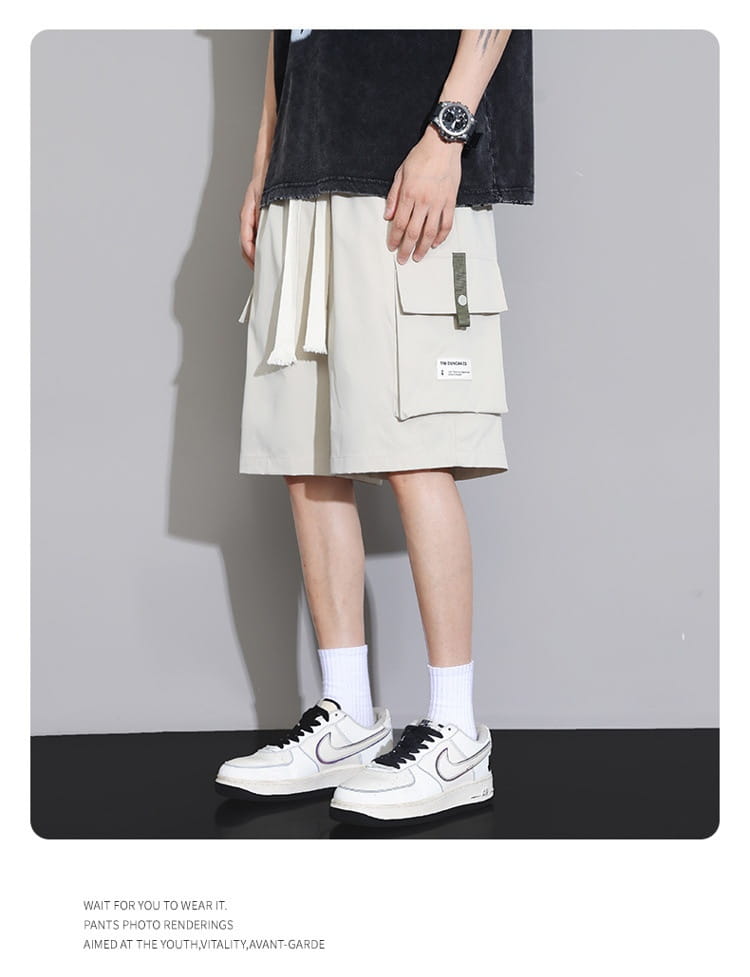Shorts cargo beige pour homme grande taille à coupe détendue, plusieurs poches et liens latéraux réglables, pour un usage décontracté et sportif