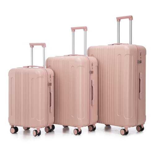 Set of three rose gold abs hard-shell spinner suitcases with vertical ribbed design and tsa lock.