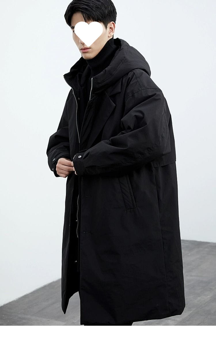 Men hooded trench coat false two piece winter jacket in black featuring a longline design with a hood and front zipper for cold weather use.