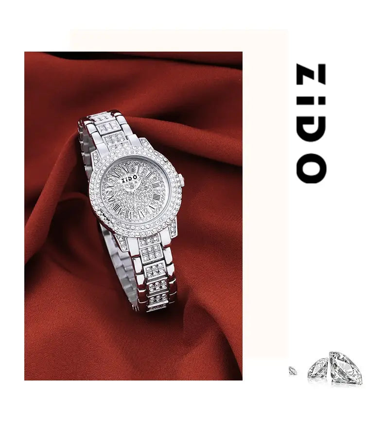 A rose gold zido women’s quartz watch featuring a sparkling silver diamond-encrusted bezel and face with roman numerals on an elegant metal bracelet.