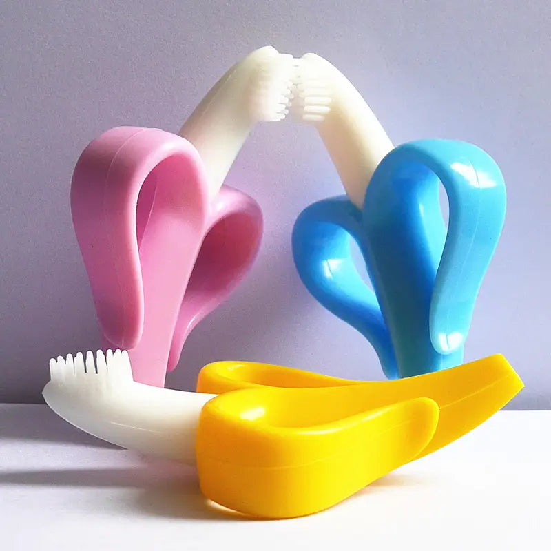 Colorful banana-shaped silicone baby teething rings in pink white blue and yellow designed as toothbrush toys for infants.