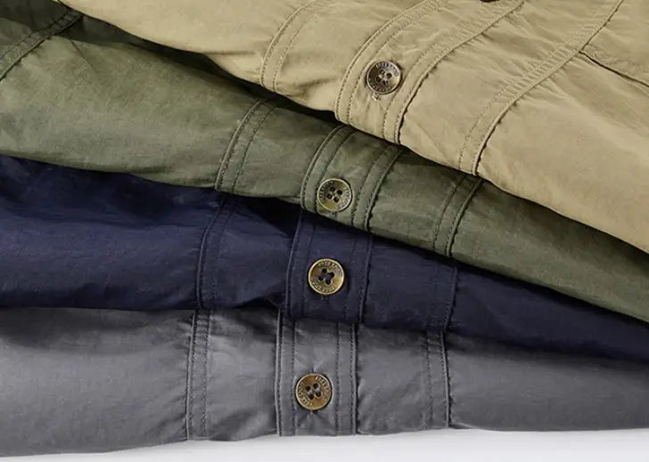 stacked cargo pants in khaki olive green navy blue and charcoal gray with brass buttons paired with men solid workwear short sleeve shirt.