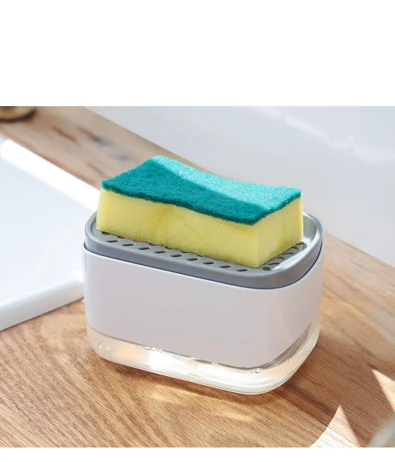 Dispensador de jabón líquido para platos de plástico blanco y gris con soporte para esponja de 350 ml, que contiene una esponja de limpieza bicolor amarillo y turquesa.