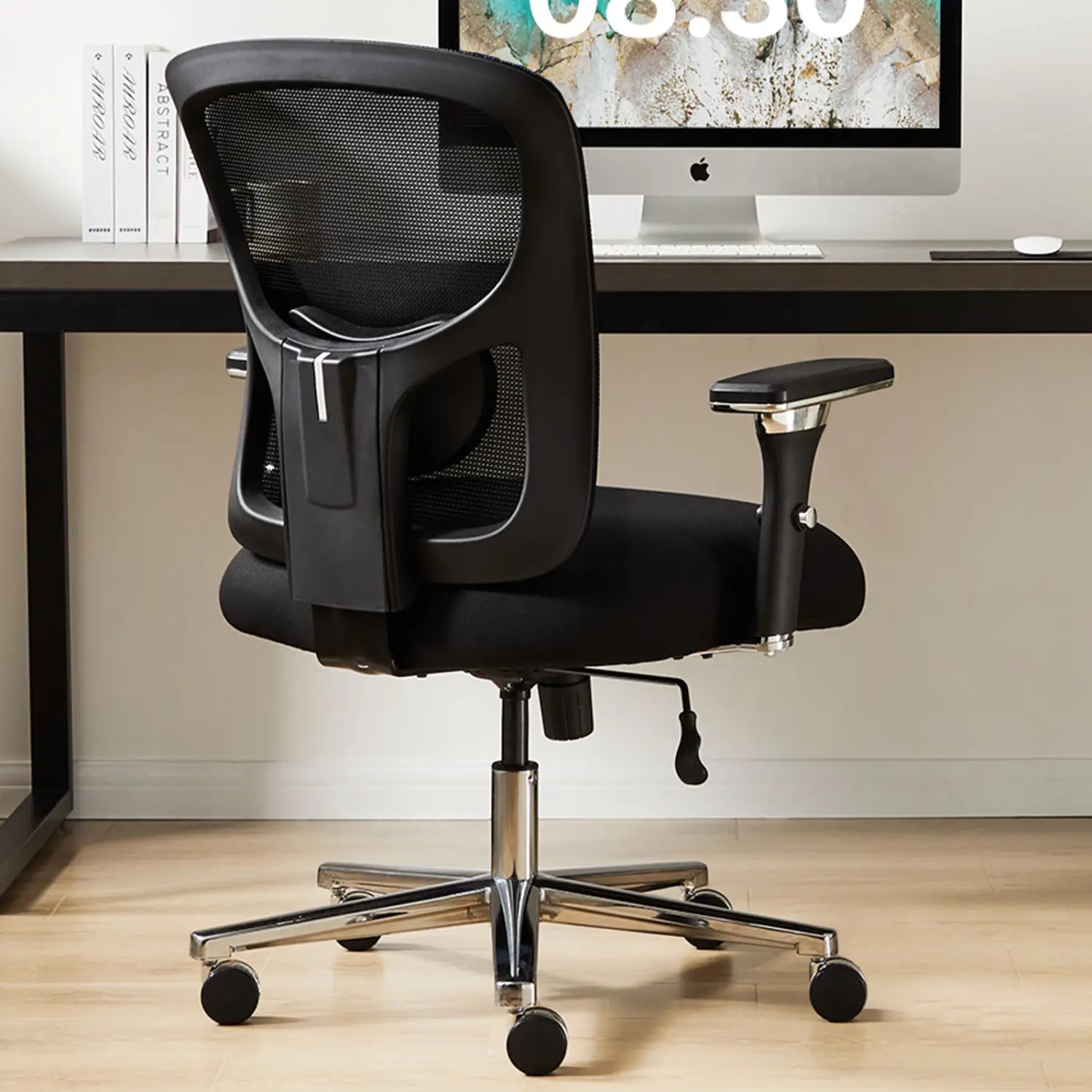 Black mesh big and tall office chair with chrome base and wheels designed for ergonomic seating and 500lb capacity.