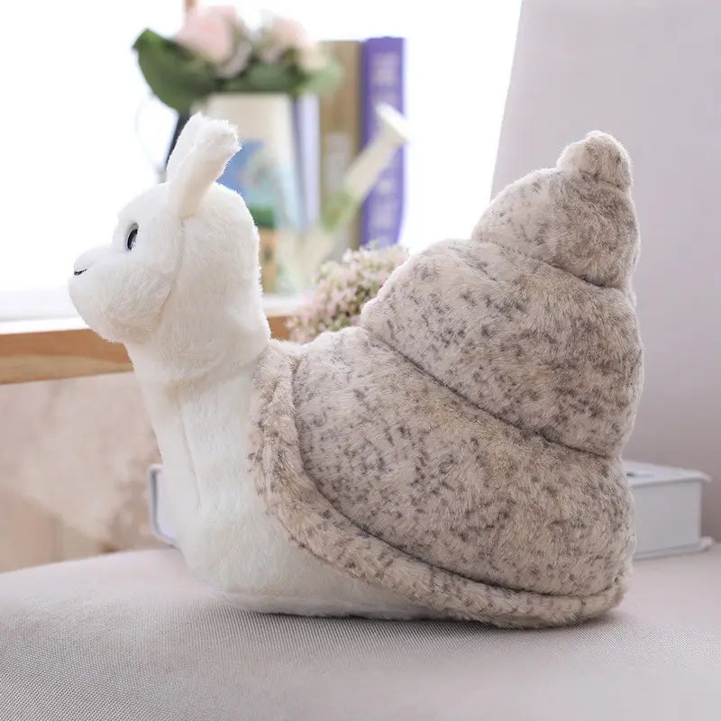 A plush white snail soft stuffed animal featuring a speckled gray shell designed as a shell doll.