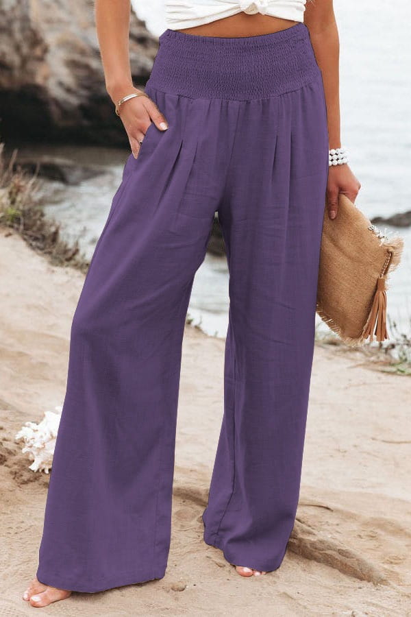 Purple high-waisted wide-leg pants for women featuring a smocked elastic waistband in solid color design.