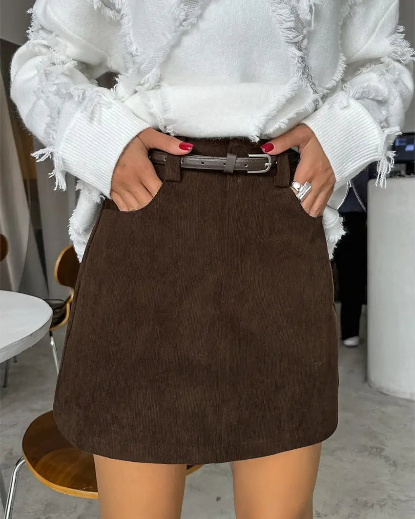 brown corduroy mini skirt with a matching belt showcasing the retro corduroy fabric and classic brown color.