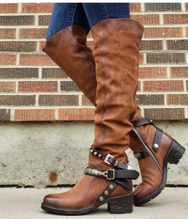 brown suede over the knee knight boots for women featuring black leather buckle straps and a chunky heel.