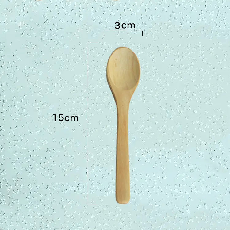 A light brown wooden spoon with a smooth rounded bowl and slender handle from a natural eco-friendly wooden spoon set for kitchen utensils.