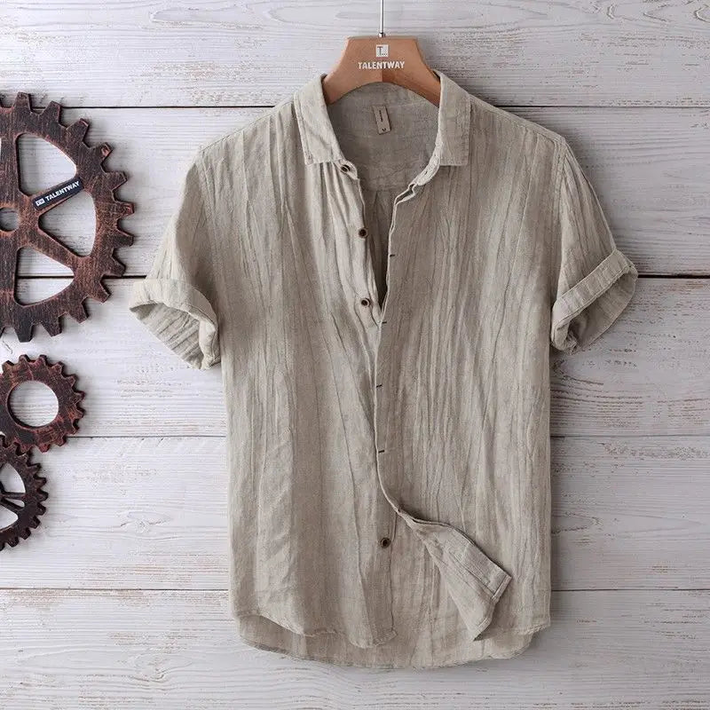 Men’s retro distressed beige linen short sleeve shirt with rolled cuffs and a subtle textured weave.