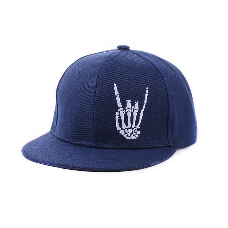 Navy blue snapback baseball cap made of fabric featuring a white embroidered skeleton hand gesture design.
