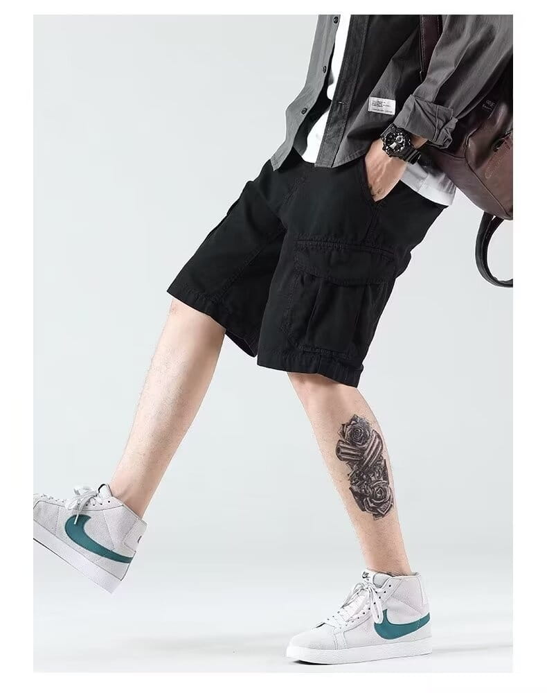 Men’s relaxed fit black cargo shorts featuring multiple pockets designed for comfort and utility.