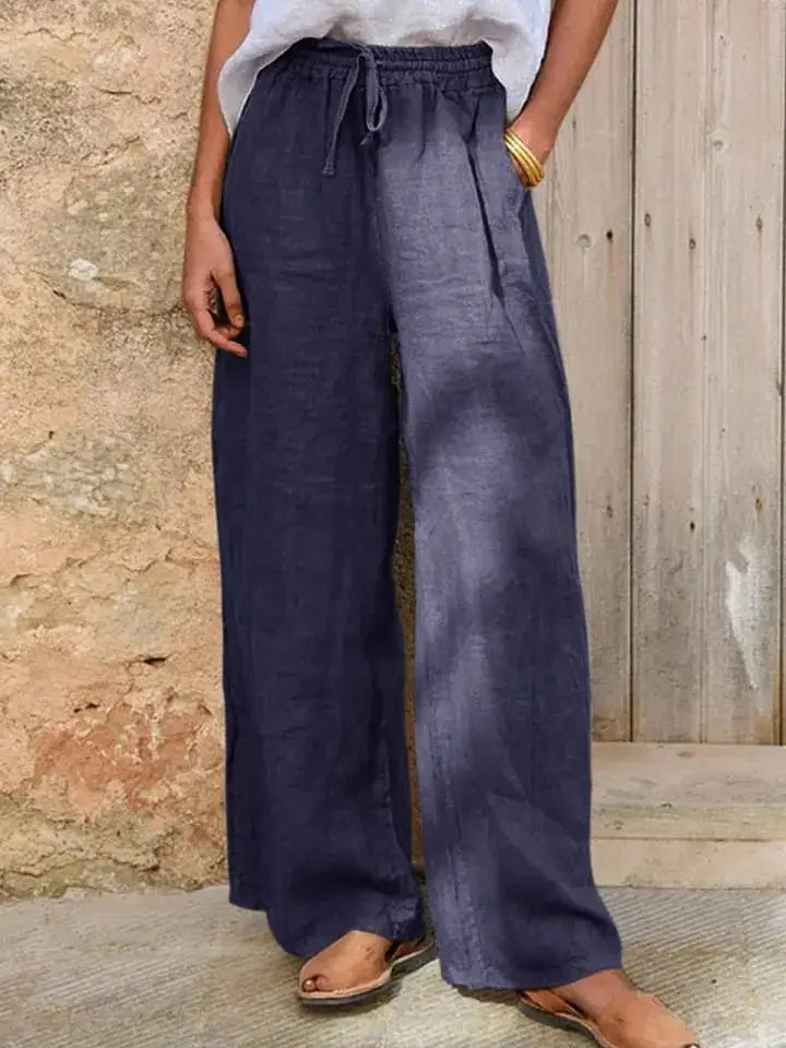 dark blue drawstring linen wide leg pants featuring loose fit linen fabric with an elastic waistband and drawstring closure