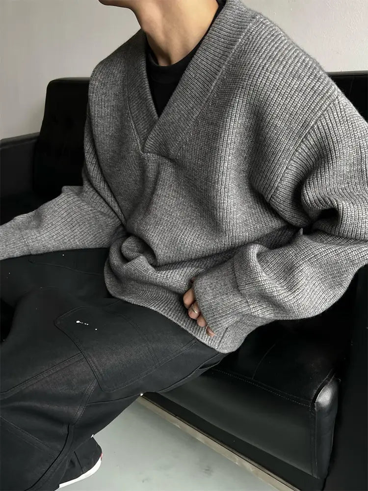 Gray ribbed knit v-neck pullover sweater made of relaxed knit fabric ideal for casual wear.
