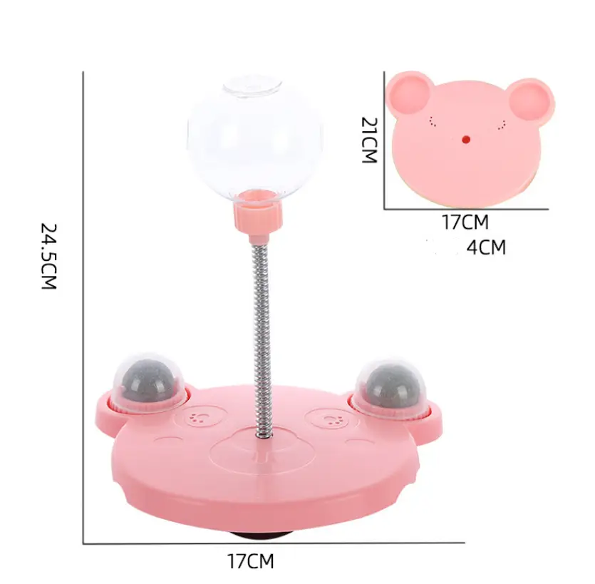 Gobelet distributeur de nourriture pour jouet puzzle en plastique rose en forme de chat et d’ours, avec sommet sphérique transparent et bases grises bombées dotées de ventouses pour plus de stabilité.