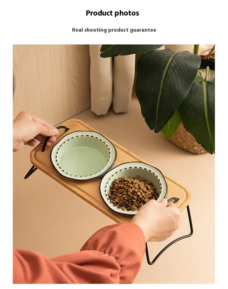 Wooden tray with an elevated ceramic cat bowl wooden stand featuring two enamel bowls one filled with pet food and the other empty