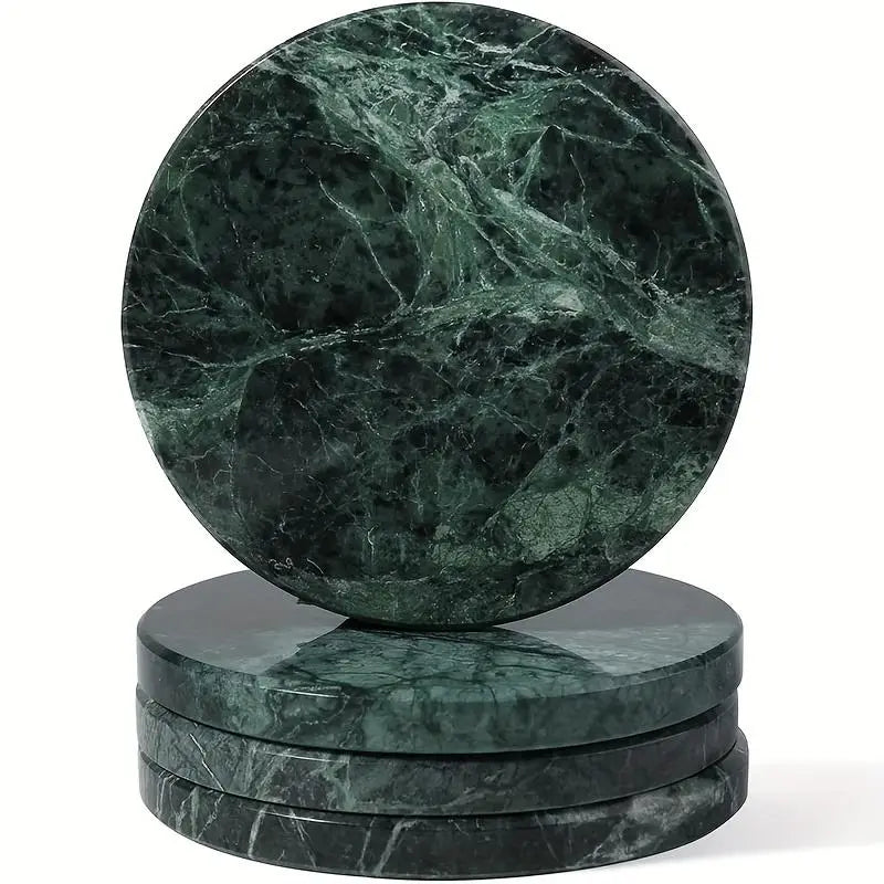 Set of four round green marble coasters featuring swirling dark and light veining made from natural stone.