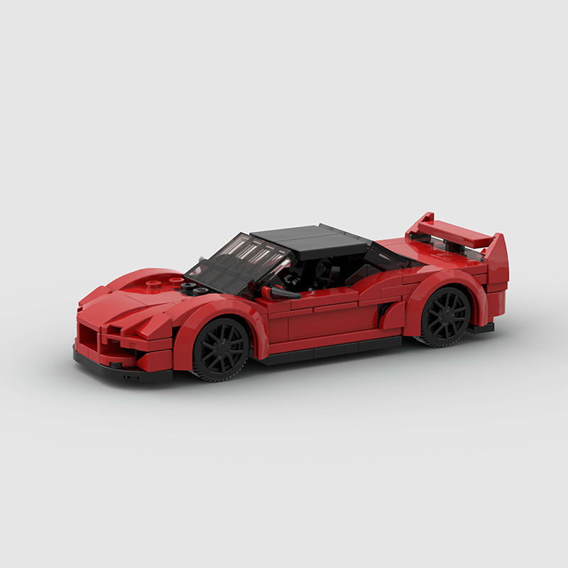 Roter Lego-Technic-Sportwagen-Baukasten als Spielzeug, mit einem roten Modell mit schwarzen Rädern und Dach.