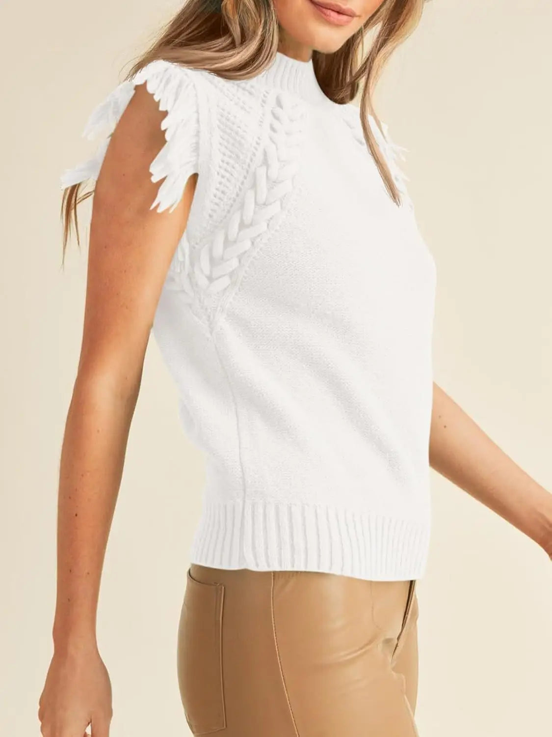 White hand-woven sleeveless knit sweater vest featuring a braided texture on the side and frayed shoulder details.